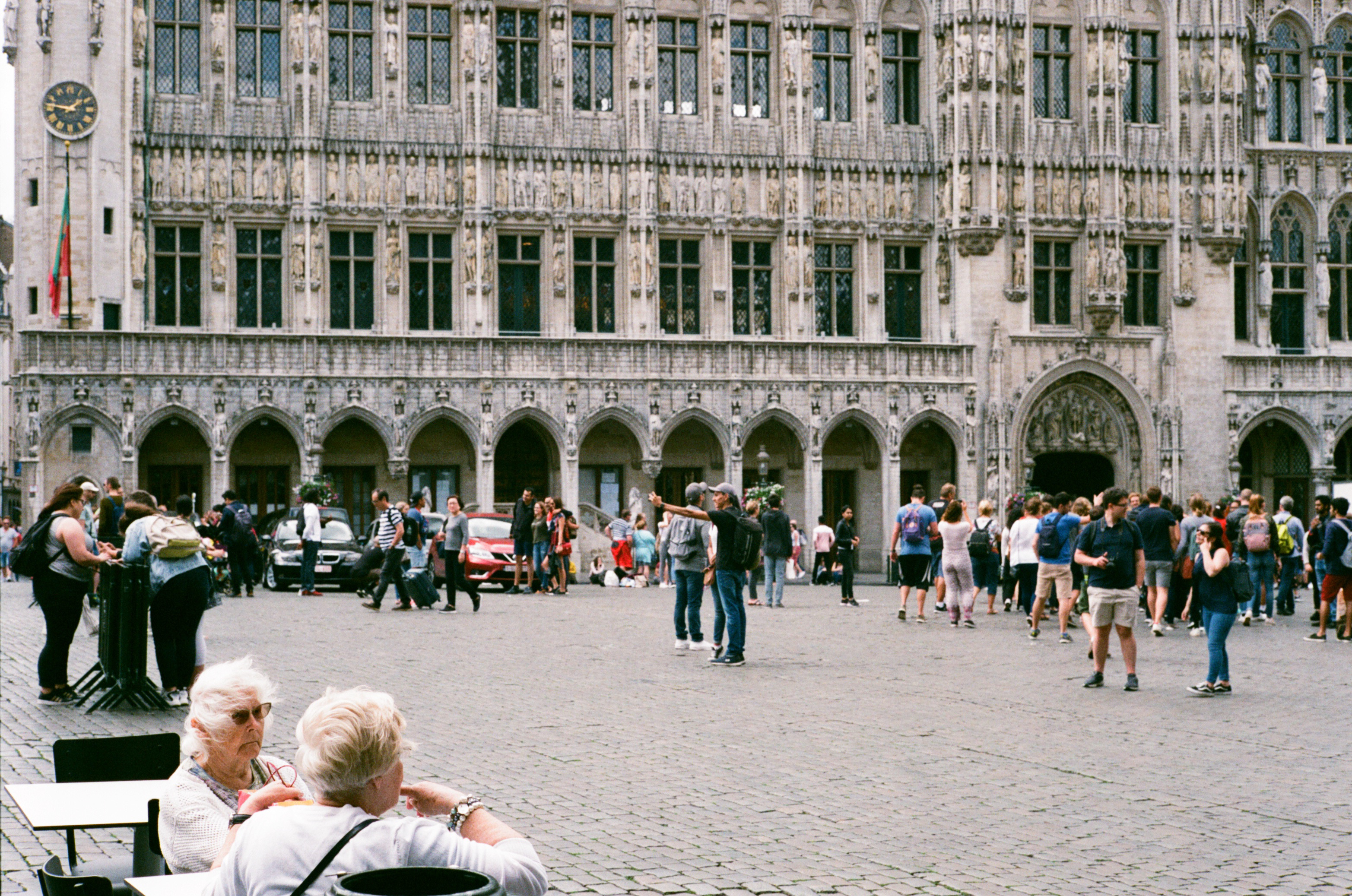 Two ladies seated in Grand Place Brussels