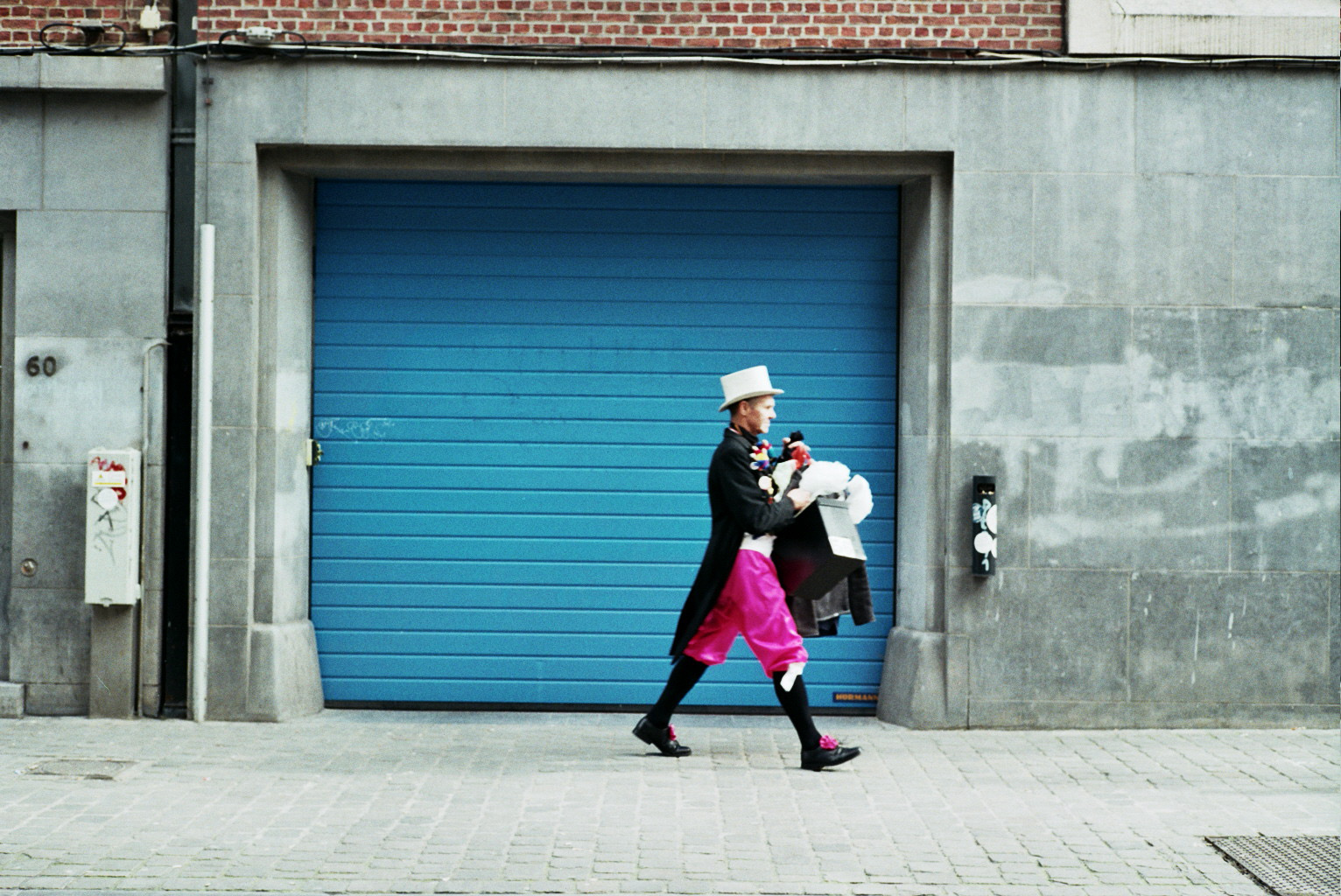 Costumed man walking to a theatre